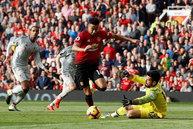 Jesse Lingard attempting to round Liverpool's Alisson, but was ultimately thwarted by the goalkeeper. It was Manchester United's clearest opportunity of note, as the two sides played out a goal-less stalemate yesterday.