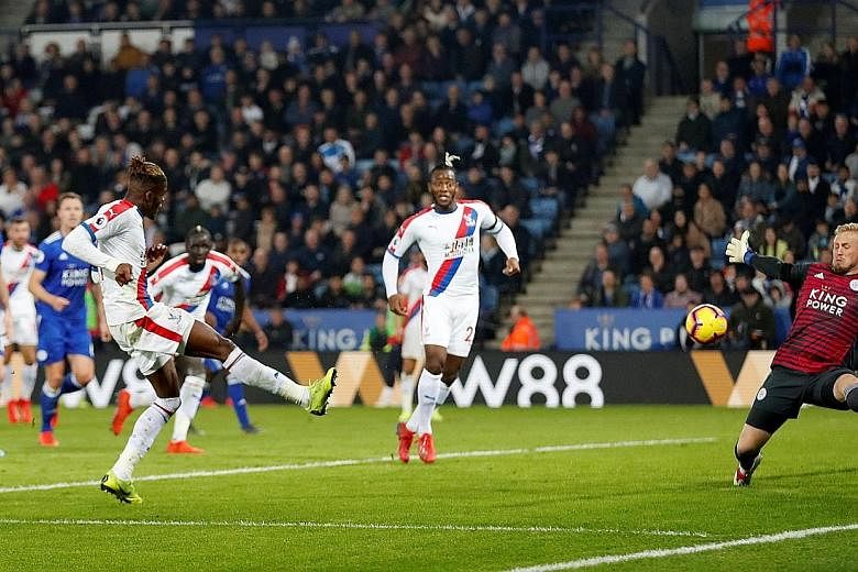 Wilfried Zaha scoring the second goal for Crystal Palace who beat Leicester 4-1 on Saturday. The Foxes dismissed manager Claude Puel after the club's fourth straight home loss.