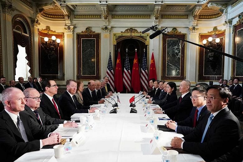 US and Chinese officials at trade talks in Washington on Thursday. The talks have been extended by two days as both sides race to reach a deal before higher US tariffs for Chinese goods kick in on March 1.