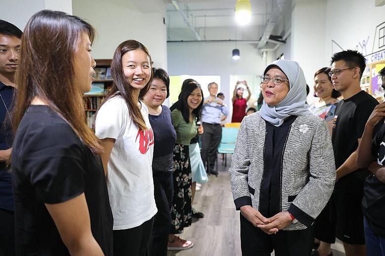 President Halimah Yacob speaking to participants of the forum theatre performance at the Singapore Association for Mental Health's Creative SAY centre in Woodlands yesterday.