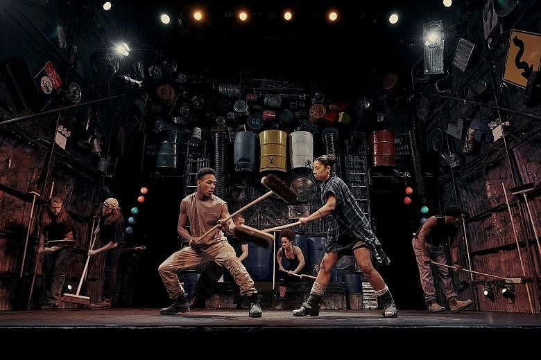 Actors in Stomp at the Orpheum Theatre in New York use everyday objects such as brooms to create a wordless percussive explosion onstage.
