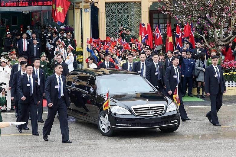 North Korean leader Kim Jong Un leaving Dong Dang station in a car for Hanoi yesterday, surrounded by his bodyguards. He arrived in Vietnam after a three-day train journey from Pyongyang. United States President Donald Trump disembarking from Air For