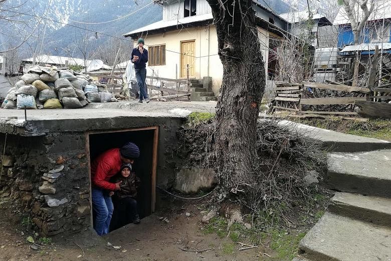 People seen preparing a bunker for emergency situations in Kashmir on Sunday amid growing tensions between India and Pakistan.