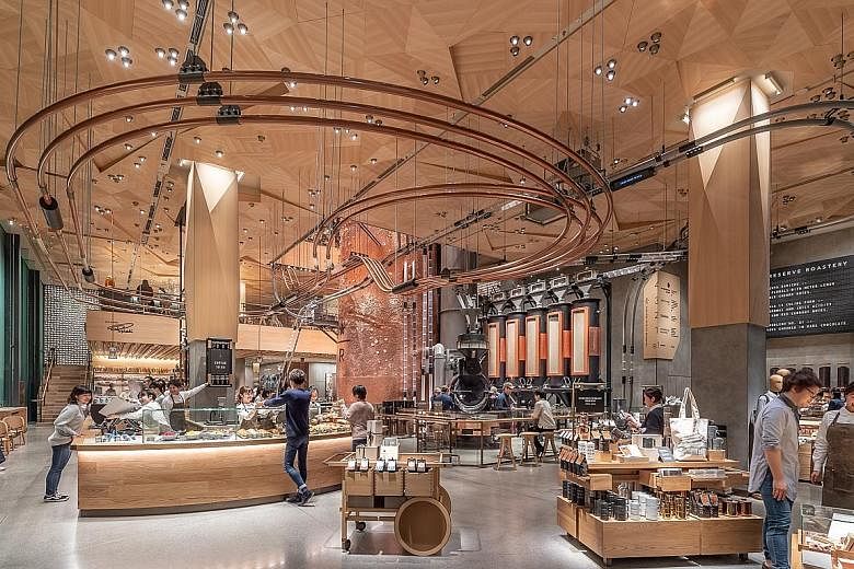 More than 680,000kg of coffee a year is expected to be roasted at the Starbucks Reserve Roastery (above and top), which has an origami-inspired wooden-tiled ceiling to celebrate Japanese craftsmanship.