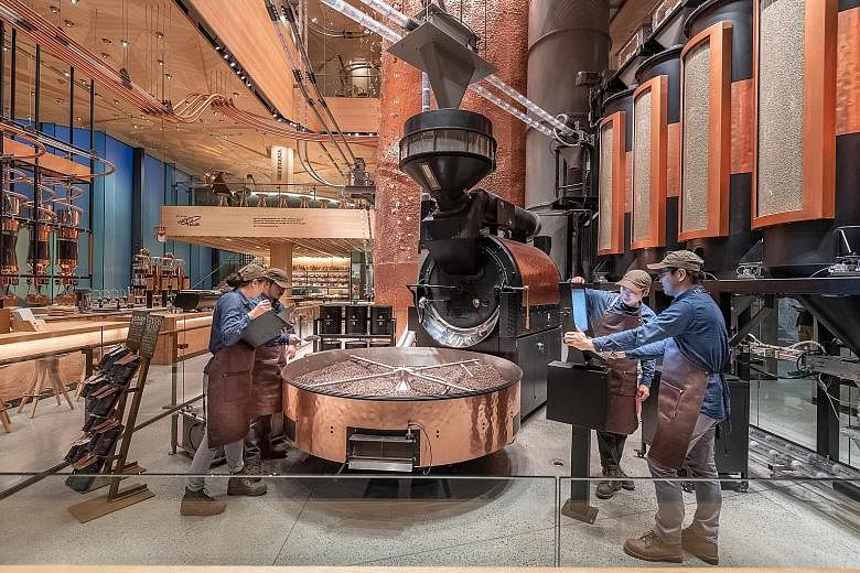 More than 680,000kg of coffee a year is expected to be roasted at the Starbucks Reserve Roastery (above and top), which has an origami-inspired wooden-tiled ceiling to celebrate Japanese craftsmanship.