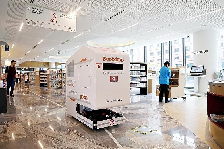 Technology is one way government agencies like the National Library Board have used to help cut costs. The NLB uses robots and automatic sorting machines to help staff and volunteers with shelving work. Library users can also check out books without 