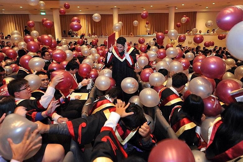 Institute of Technical Education (ITE) students celebrating at their graduation ceremony. Since 2015, the public service has been moving towards single salary schemes for officers, whether they are ITE or university graduates.