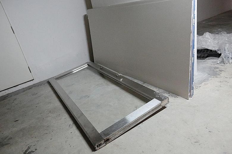 The glass door at Alexandra Central Mall's fourth-storey carpark lift lobby fell on a woman, severely injuring her.