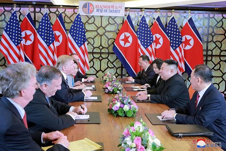 North Korean leader Kim Jong Un and US President Donald Trump and their respective delegations during their second summit in Hanoi, in a photo released yesterday by North Korea's Korean Central News Agency. The two-day summit ended early without a de