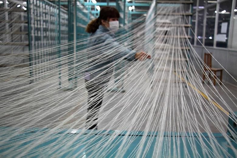 A textile factory in China. The country's factories have continued to shed jobs, a trend Beijing is monitoring as it weighs more support measures. China watchers are looking to Premier Li Keqiang's work report to the annual meeting of Parliament next