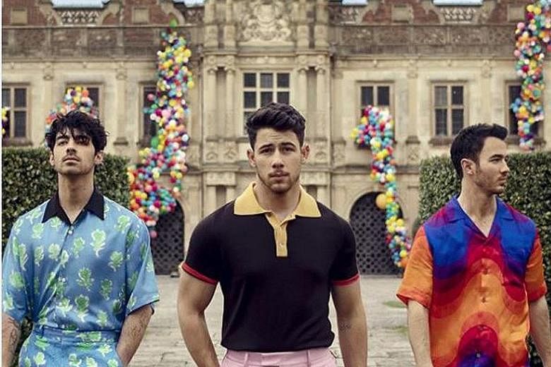 JONAS BROS RETURN: The honeymoon is over for Nick Jonas (centre) and it is back to work. On Thursday, in a Carpool Karaoke promotional spot for The Late Late Show With James Corden, the singer, who married Bollywood superstar Priyanka Chopra in Decem