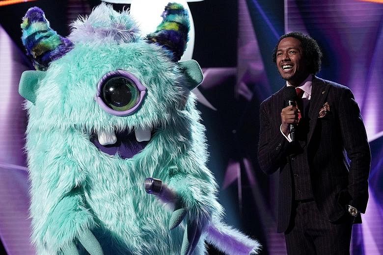 In the finale of The Masked Singer - the American version of the reality TV programme hosted by Nick Cannon (right) - the one-eyed Monster (left) turned out to be rapper T-Pain. Stars appearing in the show included singers Gladys Knight and Donny Osmond, 