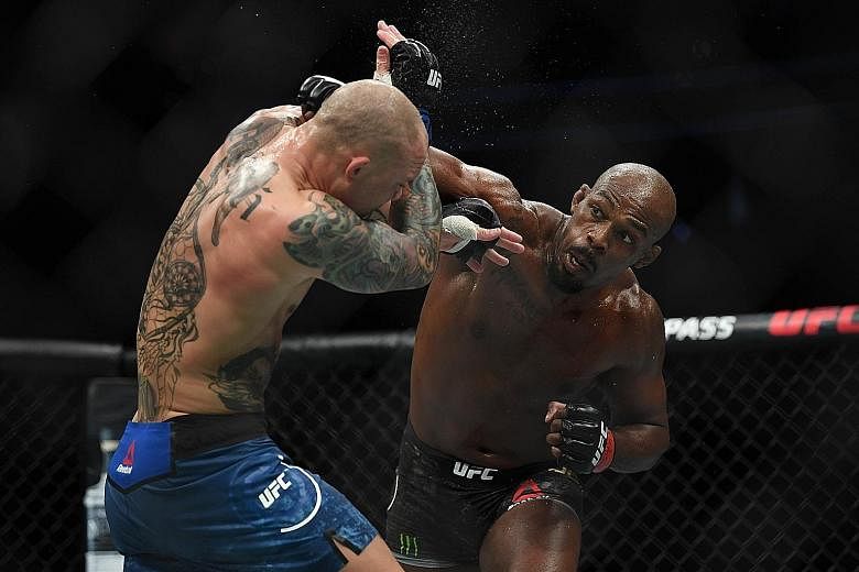 Jon Jones (black shorts) coasting to a comfortable unanimous decision victory over Anthony Smith on Saturday.