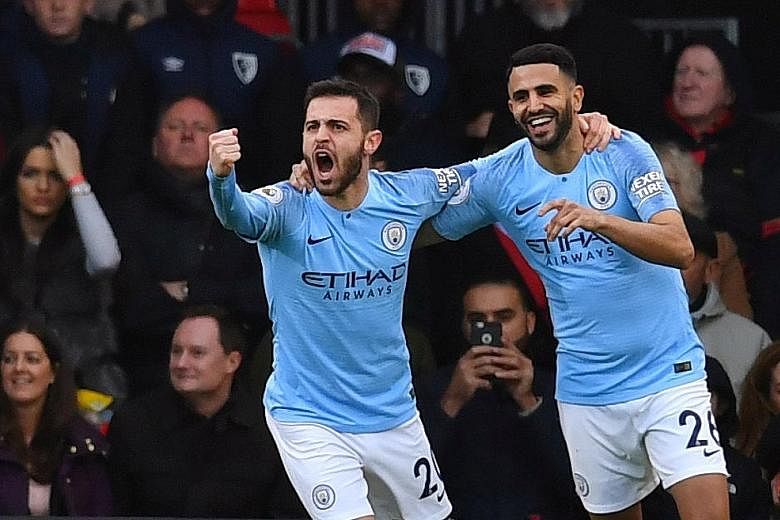 Riyad Mahrez (right) celebrating with Bernardo Silva after scoring against Bournemouth at the Vitality Stadium. Although it was the only goal of the match, champions City were overwhelmingly dominant with 82 per cent of possession.