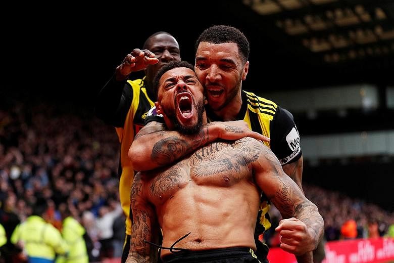 Watford substitute Andre Gray celebrates scoring his team's winner in added time to spoil Leicester manager Brendan Rodgers' first game in charge.