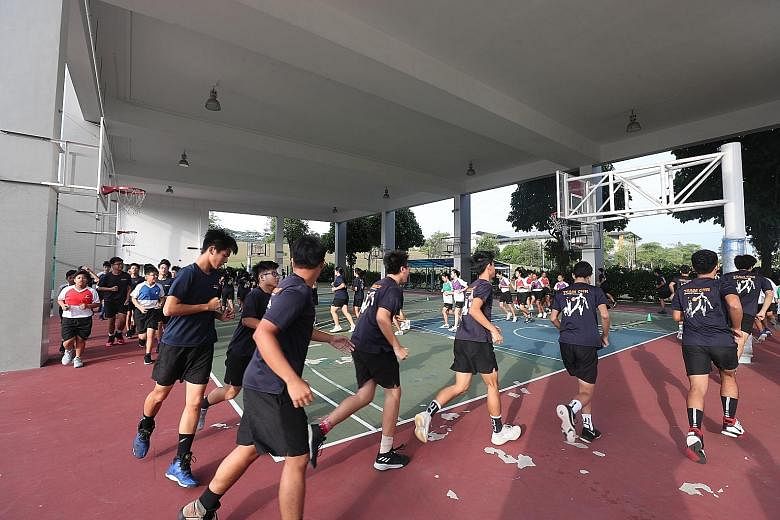 The Christ Church Secondary School basketball team trains and the band holds rehearsals on Fridays, when textbooks are ditched for co-curricular activities. The school's four-day lesson week has been in place since 2010 and CCA attendance rates have 