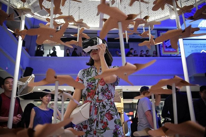A visitor at an interactive installation at SingaPlural, a design exhibition that is part of Singapore Design Week 2019.