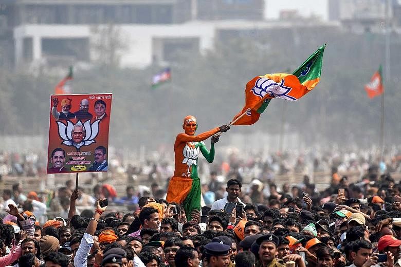 A Bharatiya Janata Party supporter waving a flag at a rally in Patna in the Indian eastern state of Bihar where Prime Minister Narendra Modi spoke on Sunday.