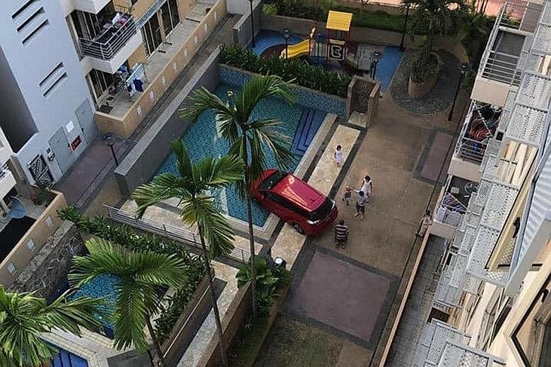 The red Honda Shuttle was reported to be a private-hire vehicle that had driven into the condominium compound on Sunday to pick up a passenger.
