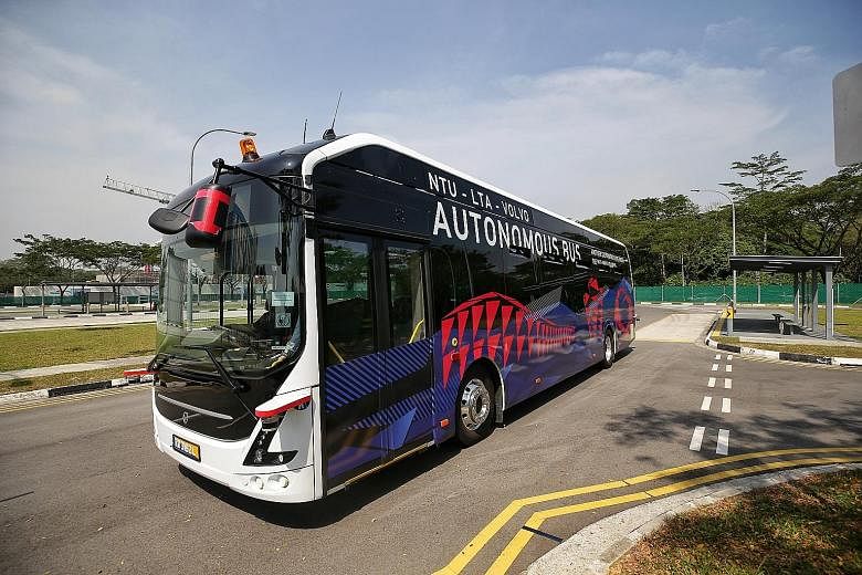 The NTU-LTA-Volvo Autonomous Bus (top left) running on a purpose-built track at Cetran. During a trial, the bus comes to a halt (above) when an errant "pedestrian" (represented by a moving dummy) is within sight. The bus is classified as having Level