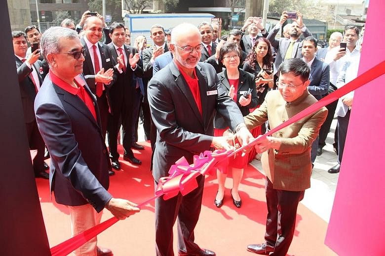 DBS chief executive Piyush Gupta officiating the opening of a new DBS branch in Mumbai. The Singapore lender is the first major foreign bank to set up a local unit in India, the world's second-most populous nation.