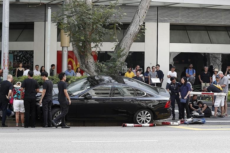 Three men were injured after a car mounted a kerb outside Raffles City Shopping Centre, near The Botanic Restaurant, yesterday. The police said it was alerted to an accident along Bras Basah Road towards Nicoll Highway at 4.40pm. The three pedestrian