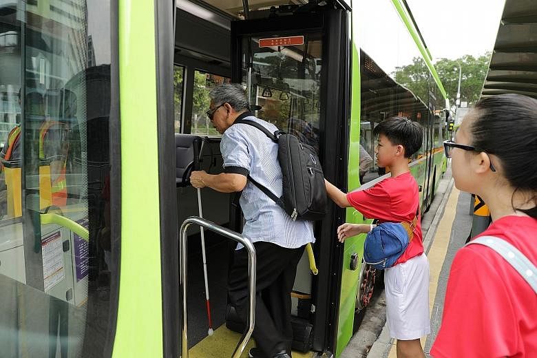 Students from Chung Cheng High School (Yishun) helping a commuter in Khatib board a bus safely.