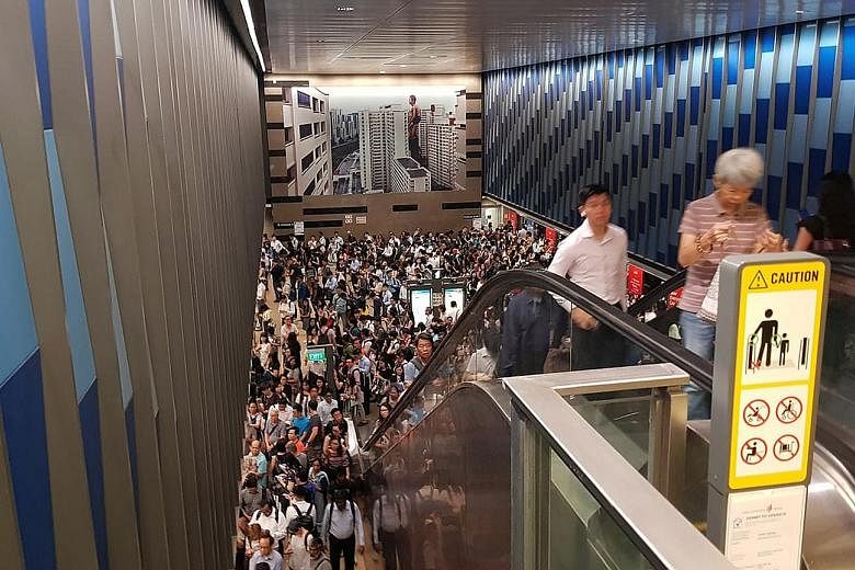 Commuters packing the Bukit Panjang MRT station yesterday. Service was delayed from as early as 7.45 am and operations started to return to normal just after 9am.