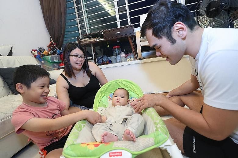 Housewife Lee Siok Hong, 38, and engineer Rick Tan, 37, with their children - six-year-old Oscar and five-month-old Mavis. The Tans currently pay about $600 after subsidies for Oscar's pre-school fees. Ms Lee said the increased subsidies will help ea