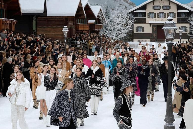 An over-the-top winter wonderland (left) was the backdrop for the Chanel show.