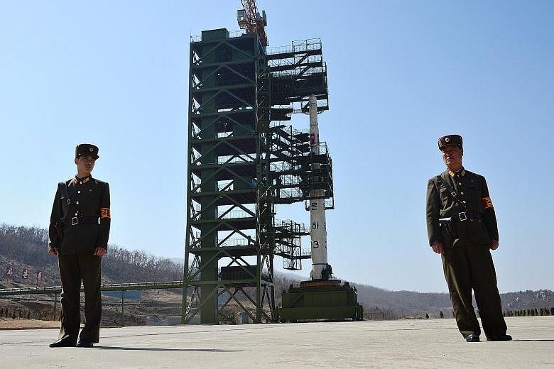 An April 2012 photo showing North Korean soldiers guarding the Unha-3 rocket at the Sohae satellite launch station. The site was partially dismantled as a goodwill gesture by Pyongyang last August.