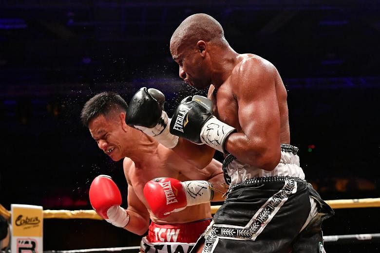 Muhamad Ridhwan taking a blow from Paulus Ambunda during their International Boxing Organisation super bantamweight world title bout last September. The Namibian won by a split decision, and the Singaporean will be keen to set the record straight whe