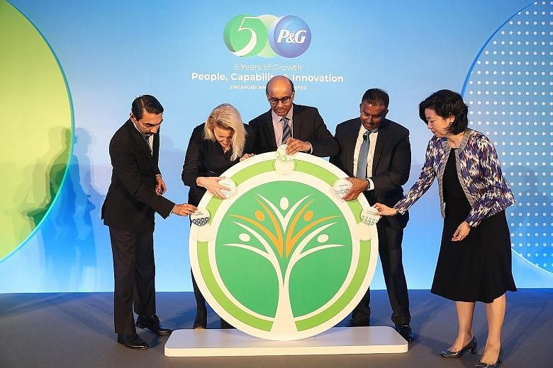 Deputy Prime Minister Tharman Shanmugaratnam was the guest of honour yesterday at the fifth anniversary of P&G's Singapore Innovation Centre, where he was joined by (from left) A*Star managing director Raj Thampuran; Ms Kathy Fish, P&G's chief resear