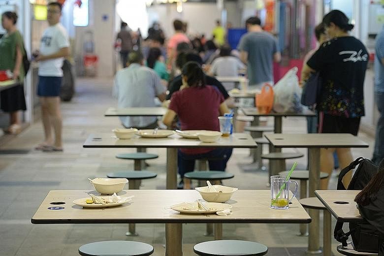 Used crockery left on the tables by patrons at Marsiling Mall hawker centre, one of the three hawker centres in the centralised dishwashing subsidy programme. The stallholders currently get two years of subsidies for centralised dishwashing under the
