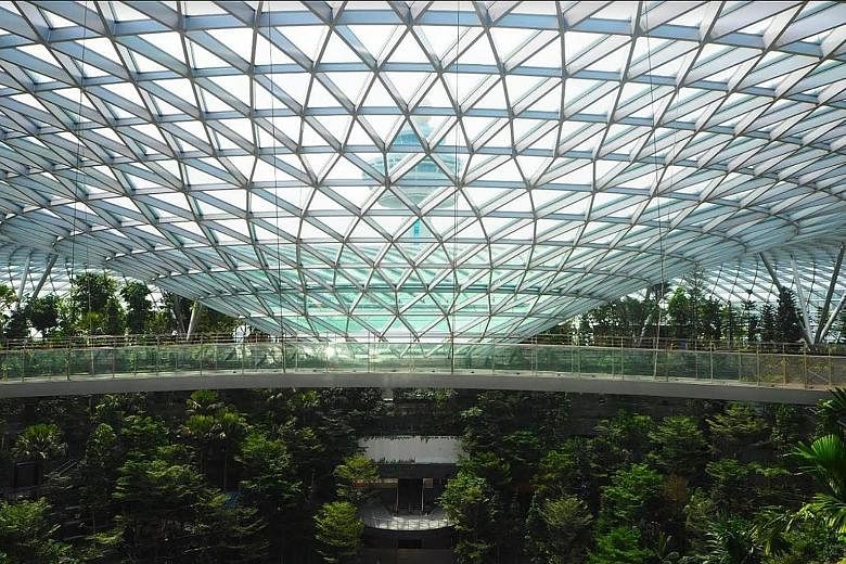 Jewel Changi Airport's five-storey garden, with 2,500 trees and 100,000 shrubs. Other highlights include the 40m-high Rain Vortex - the world's tallest indoor waterfall.