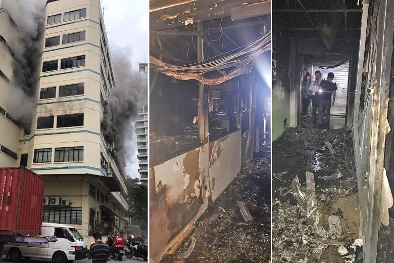 Smoke caused by a fire billowing out of a building near Balestier Road yesterday, and the blackened interior of the third-floor office where the blaze took place. Computers, furniture and air-conditioning units were destroyed in the office of N.K. Lu