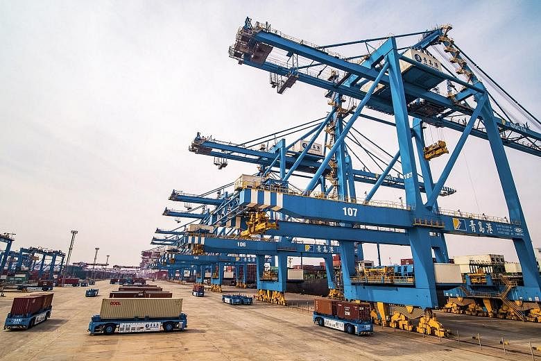 A port in Qingdao in China's Shandong province. February exports fell 20.7 per cent from a year earlier, the largest fall since February 2016, Customs data showed yesterday.