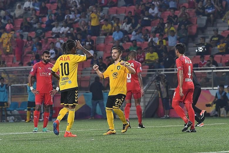 Tampines Rovers' Jordan Webb celebrating with Zehrudin Mehmedovic after scoring their fifth goal against Home United from the spot. Home, who beat Albirex Niigata in the Community Shield on penalties, have started the season poorly. They have a draw 