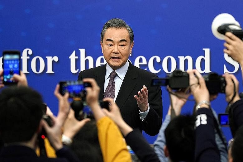 Speaking at a media conference yesterday on the sidelines of China's annual parliamentary meetings, Foreign Minister Wang Yi urged greater cooperation rather than competition with the US, adding that Beijing hopes Washington will "abandon its zero-su