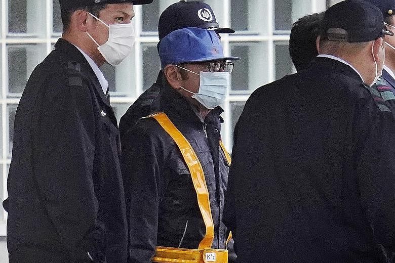 Lawyer Takashi Takano (above) said he had hoped that the disguise would stop the media on Wednesday from tracking Carlos Ghosn (left) to his court-designated residence.