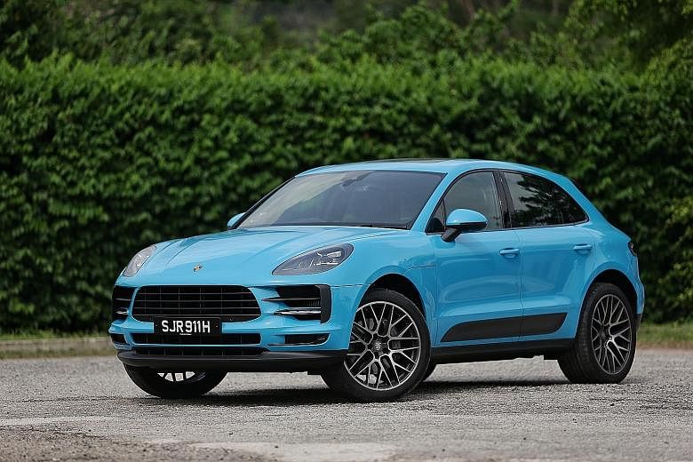 The facelifted Porsche Macan has a redesigned front bumper with wider side air intakes and LED headlights, and its tail lamps stretch across the width of the car.