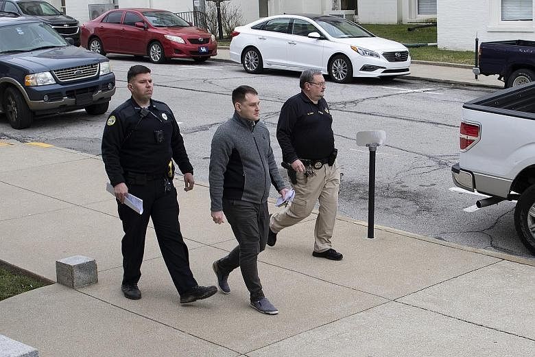 Mikhy Farrera-Brochez being escorted on Feb 18 from the Clark County District Court in Winchester, Kentucky, where he pleaded not guilty to a trespassing charge. The charges brought against him by the grand jury on Thursday relate to e-mails he sent 