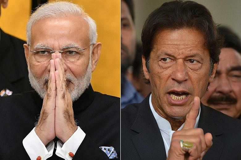 Indian Prime Minister Narendra Modi (left) roused his countrymen at rallies while his Pakistani counterpart Imran Khan's peace gesture over the Indian pilot has won praise at home.