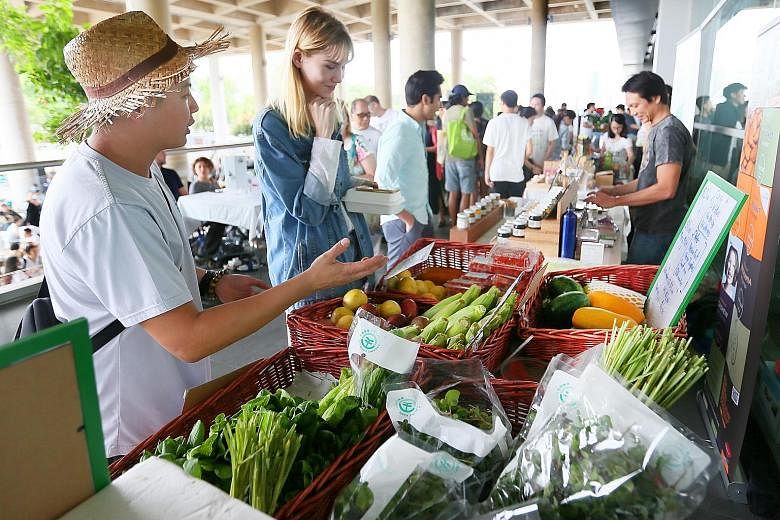 Locally grown organic produce on sale at an event at the Marina Barrage last year. Environment and Water Resources Minister Masagos Zulkifli unveiled the ambitious target of locally producing almost one-third of the food that Singapore needs by 2030.