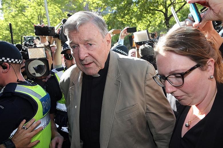 Archbishop William Goh (above) last September addressed the disquiet over the scandals overseas, during which he said there has been no "cover-up" in the Archdiocese of Singapore. Australian Cardinal George Pell (right), the No. 3 man in the Vatican,