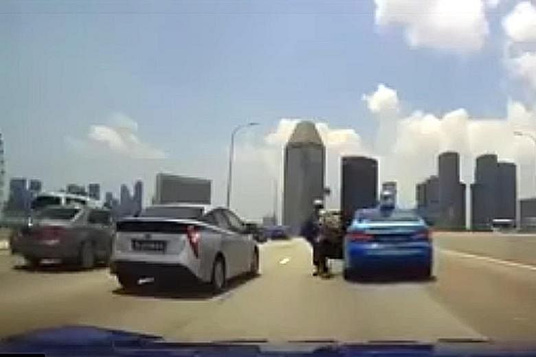 Dashcam footage shows the passenger leaving the taxi that had earlier collided with the centre divider of the Benjamin Sheares Bridge.