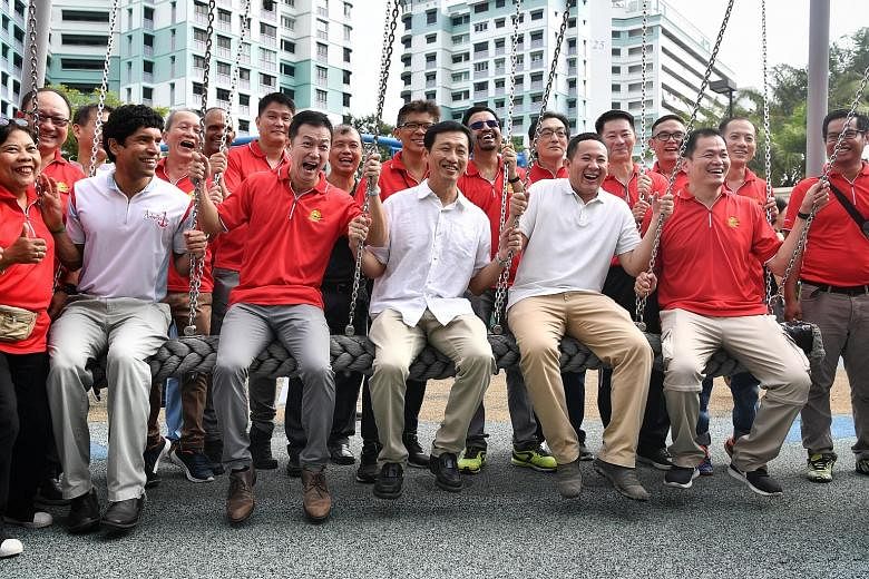 (Seated, from left) Sembawang GRC MPs Vikram Nair, Lim Wee Kiak, Education Minister Ong Ye Kung and Senior Parliamentary Secretary Amrin Amin, and grassroots leader Markus Koo, trying out a swing at the Canberra Day 2019 carnival for residents yester