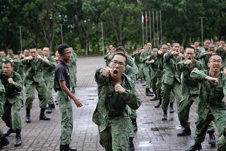 Recruits at the Basic Military Training Centre on Pulau Tekong last year. The latest batch of Singapore Armed Forces army recruits were unable to complete the required build-up training in time for the usual 24km graduation march after a two-week saf