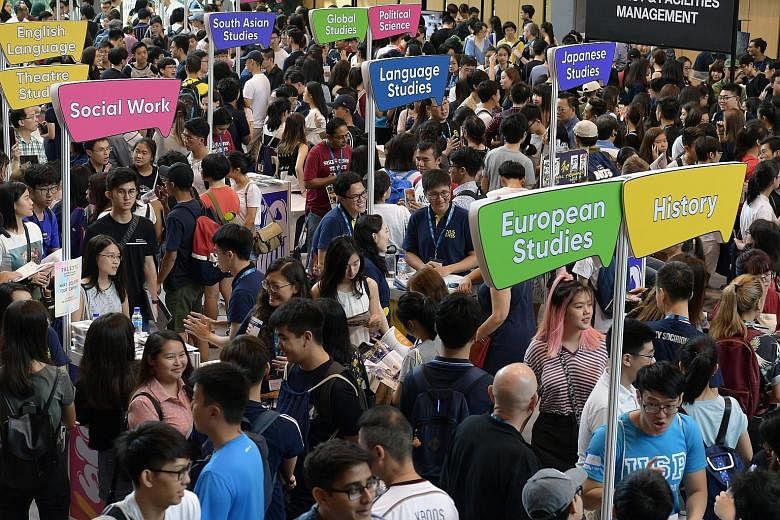 Prospective students at an open house at the National University of Singapore at the weekend. The intake for its School of Computing nearly doubled from about 500 in 2015 to 1,000 last year. A similar number of students is expected for this year's in
