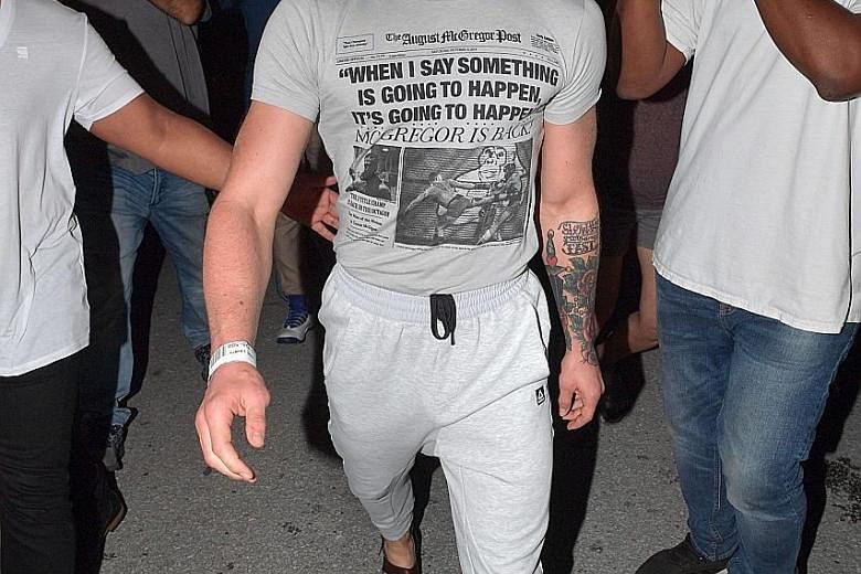 Conor McGregor walking out of the Turner Guilford Knight Correctional Centre after his release, following his arrest for smashing the phone of a fan who tried to take pictures of the mixed martial arts fighter early Monday morning.